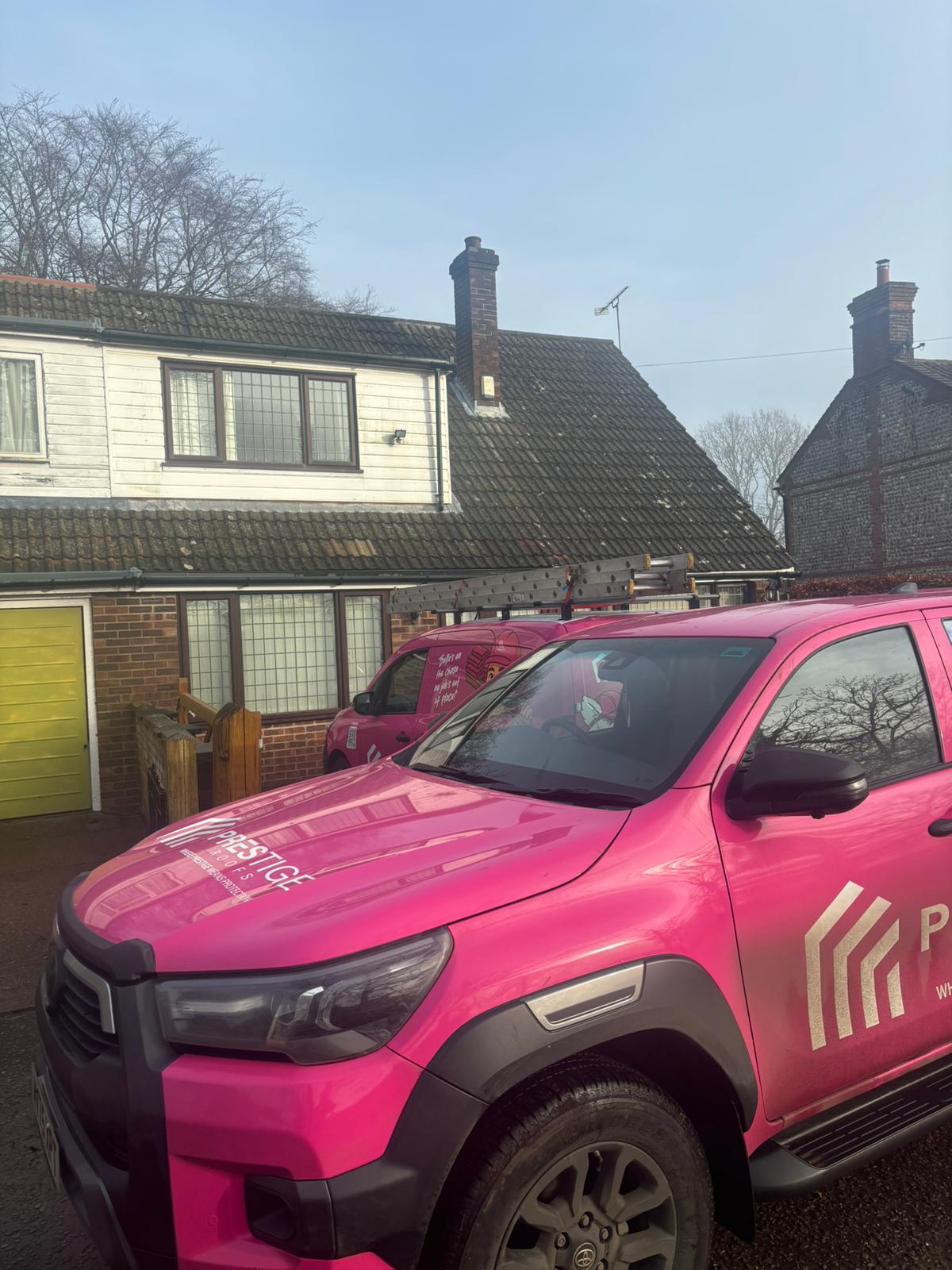 Pink Prestige Roof van parked outside a bungalow in Roughton, Norfolk ahead of a major chimney repair